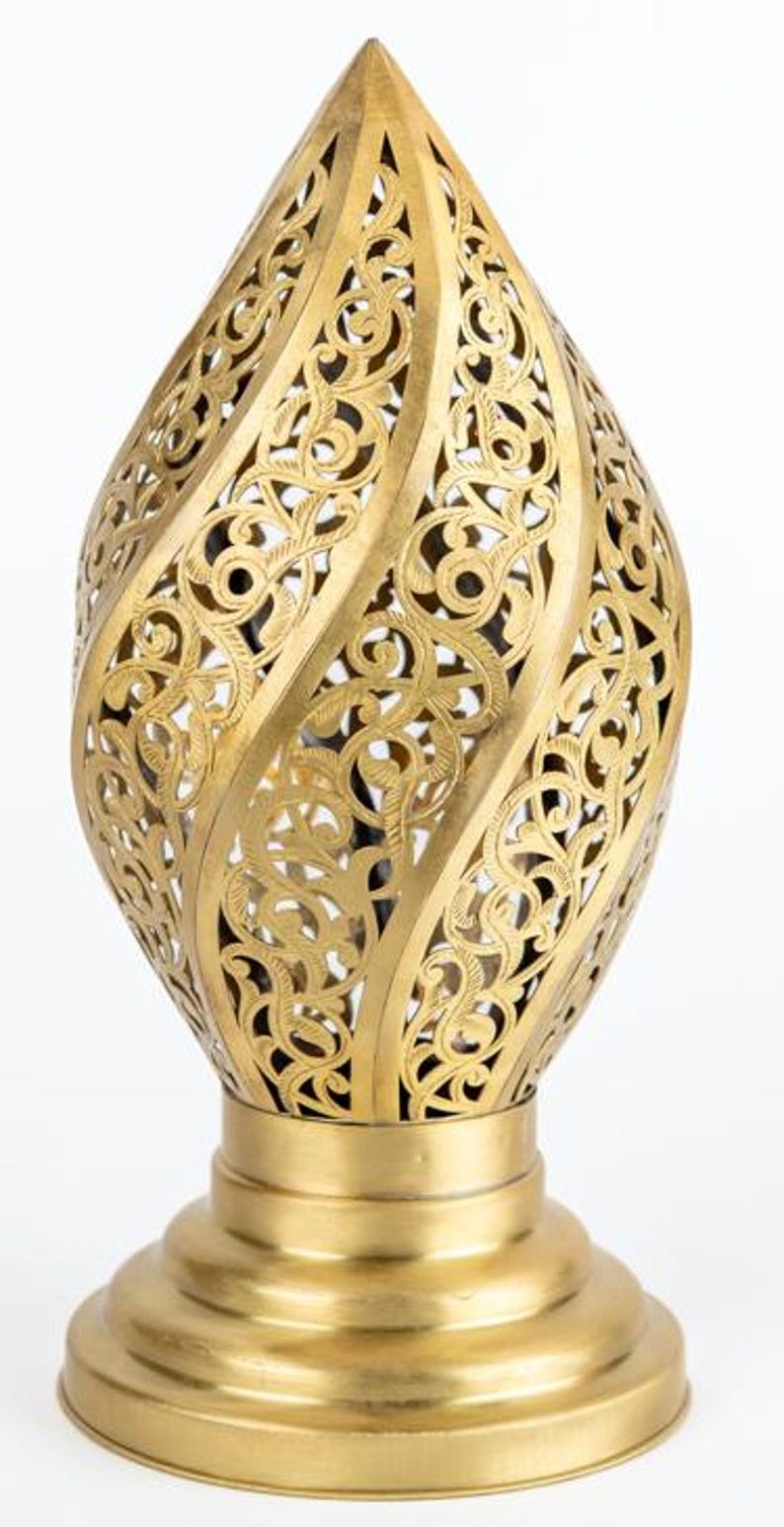 Handmade Moroccan Brass Flame Table Lamp – Ornate Pierced Brass Lantern with Swirling Arabesque Cutouts, Warm Gold Glow and Sculptural Tiered Base