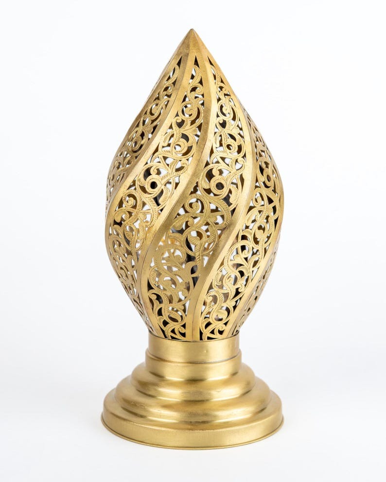 Handmade Moroccan Brass Flame Table Lamp – Ornate Pierced Brass Lantern with Swirling Arabesque Cutouts, Warm Gold Glow and Sculptural Tiered Base