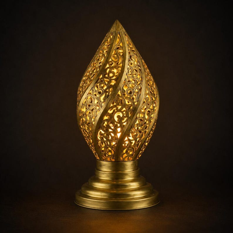 Handmade Moroccan Brass Flame Table Lamp – Ornate Pierced Brass Lantern with Swirling Arabesque Cutouts, Warm Gold Glow and Sculptural Tiered Base