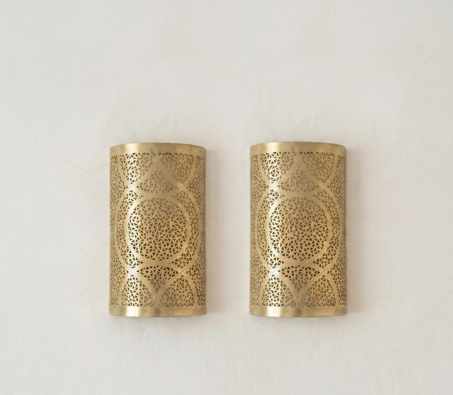 Handmade Moroccan Brass Cylinder Wall Sconce – Pierced Geometric Wall Light with Circular Arabesque Pattern, Warm Golden Glow and Dramatic Shadow Projection