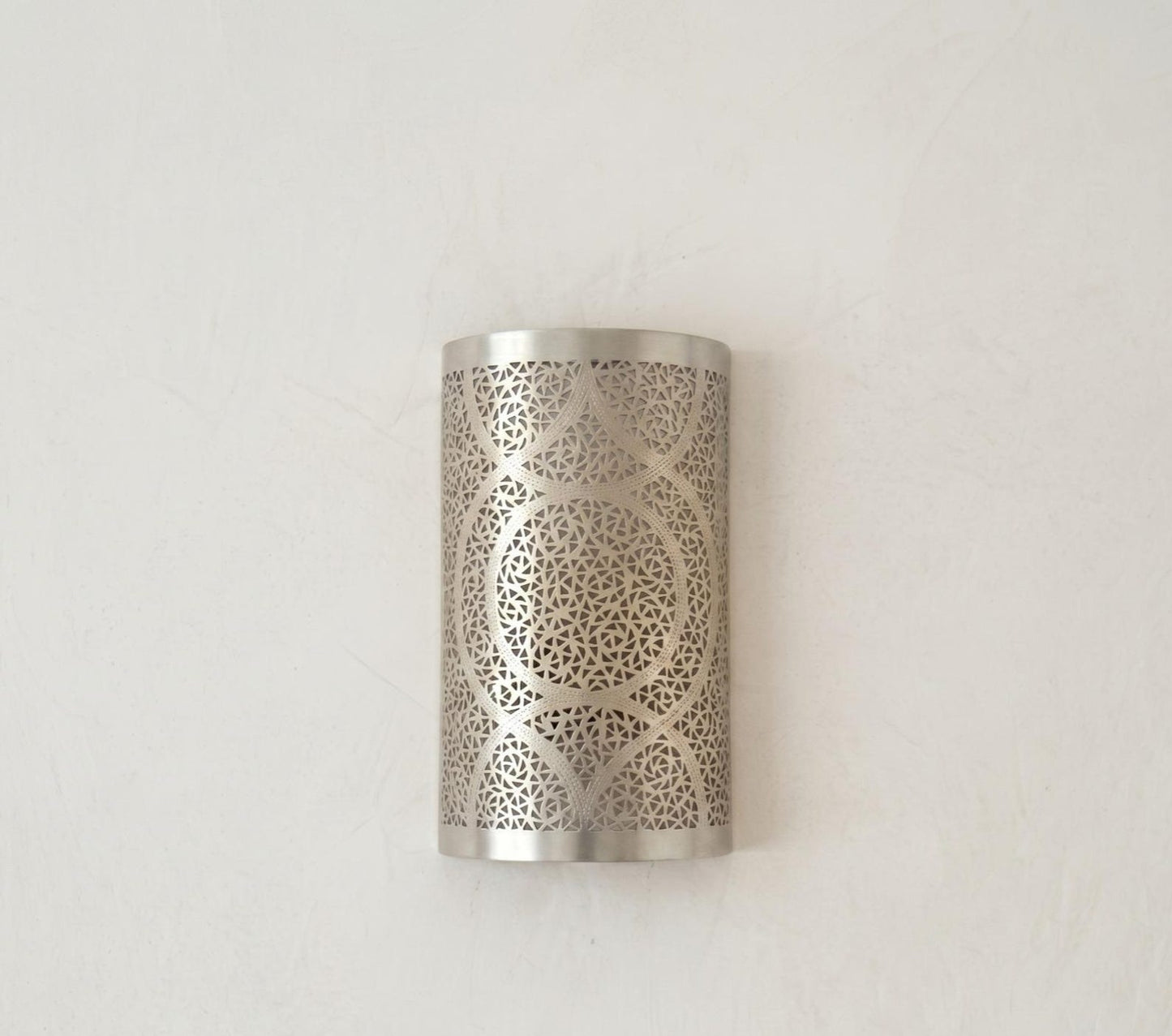 Handmade Moroccan Brass Cylinder Wall Sconce – Pierced Geometric Wall Light with Circular Arabesque Pattern, Warm Golden Glow and Dramatic Shadow Projection
