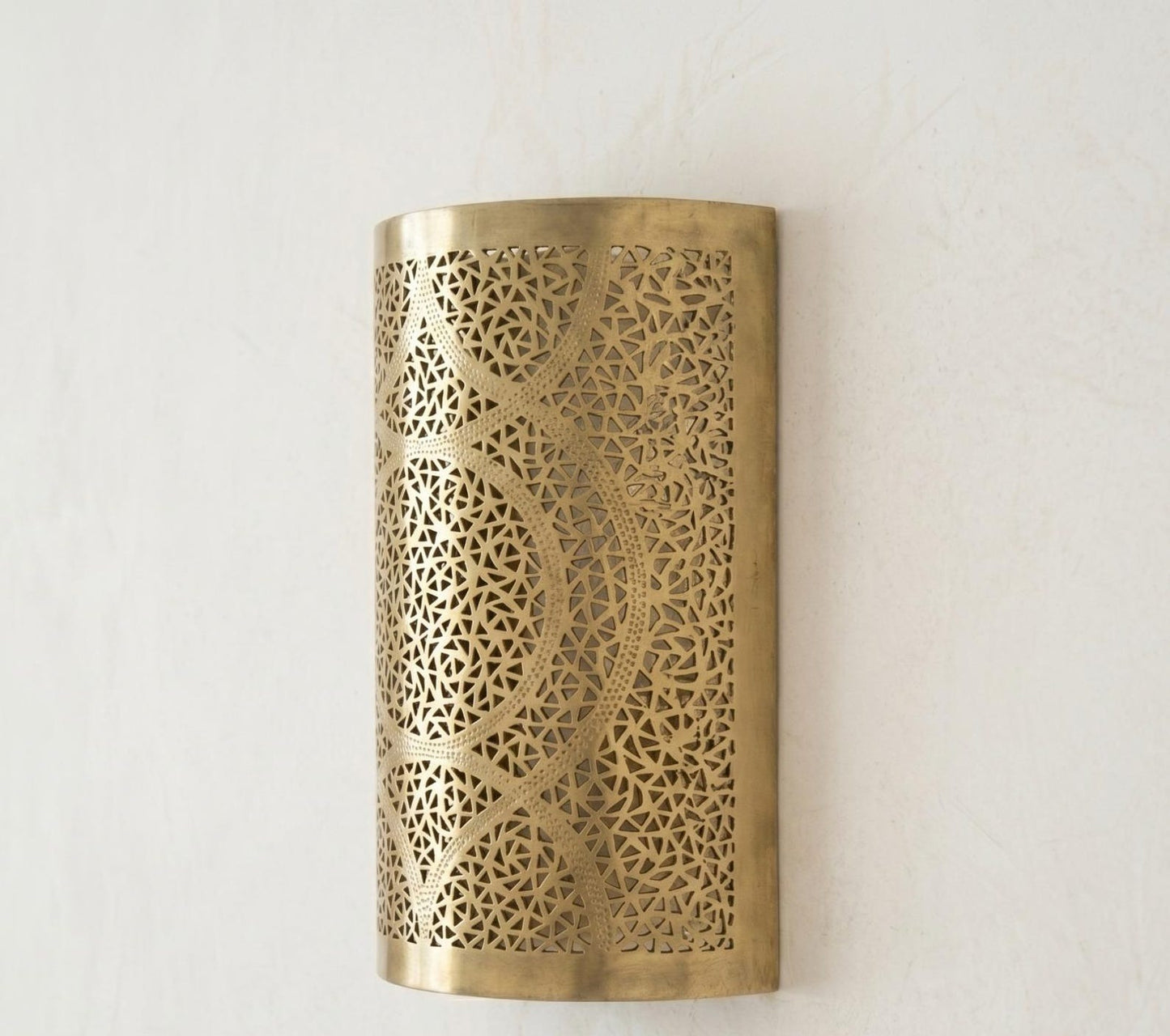 Handmade Moroccan Brass Cylinder Wall Sconce – Pierced Geometric Wall Light with Circular Arabesque Pattern, Warm Golden Glow and Dramatic Shadow Projection