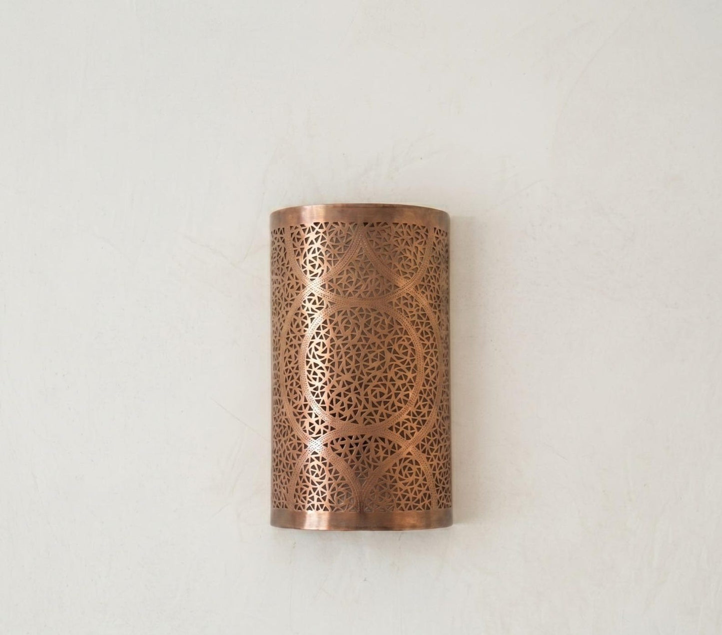 Handmade Moroccan Brass Cylinder Wall Sconce – Pierced Geometric Wall Light with Circular Arabesque Pattern, Warm Golden Glow and Dramatic Shadow Projection