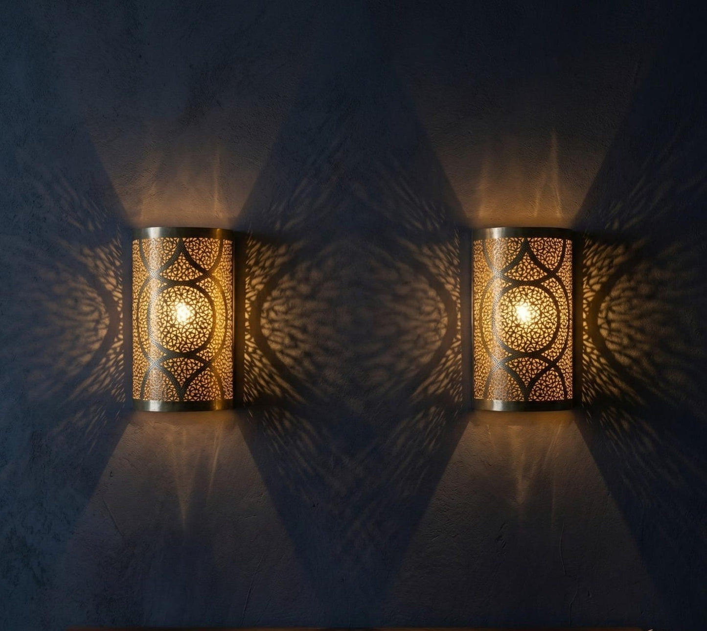 Handmade Moroccan Brass Cylinder Wall Sconce – Pierced Geometric Wall Light with Circular Arabesque Pattern, Warm Golden Glow and Dramatic Shadow Projection