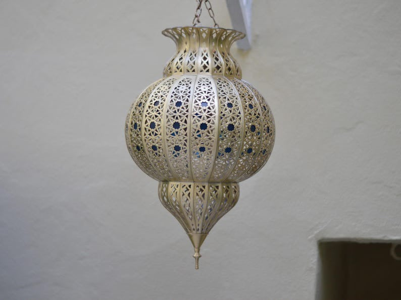 Handmade Moroccan Brass Lantern Pendant Light – Ornate Pierced Globe Hanging Lamp with Blue Glass Accents and Dramatic Moorish Shadow Patterns for Entryway, Bedroom & Living Room