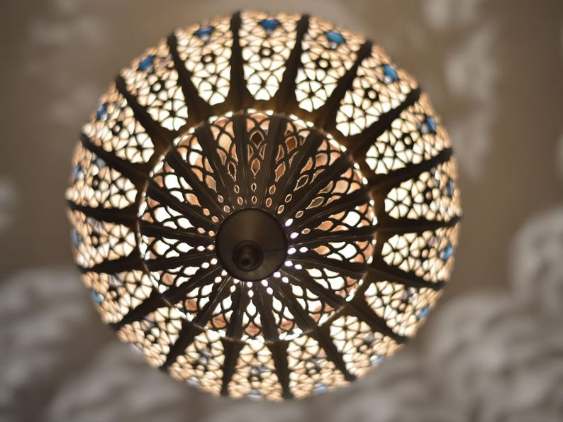 Handmade Moroccan Brass Lantern Pendant Light – Ornate Pierced Globe Hanging Lamp with Blue Glass Accents and Dramatic Moorish Shadow Patterns for Entryway, Bedroom & Living Room