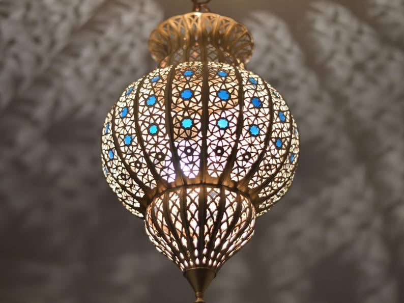Handmade Moroccan Brass Lantern Pendant Light – Ornate Pierced Globe Hanging Lamp with Blue Glass Accents and Dramatic Moorish Shadow Patterns for Entryway, Bedroom & Living Room
