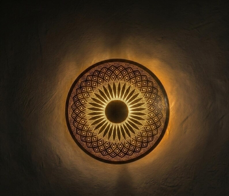 Handmade Moroccan Brass Round Wall Sconce – Pierced Sunburst Mandala Light with Geometric Diamond Patterns, Warm Golden Halo and Decorative Shadow Glow