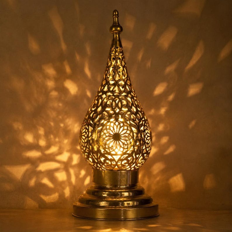 Handmade Moroccan Brass Teardrop Table Lamp – Ornate Pierced Brass Lantern with Floral Arabesque Cutouts, Warm Gold Glow and Dramatic Shadow Patterns