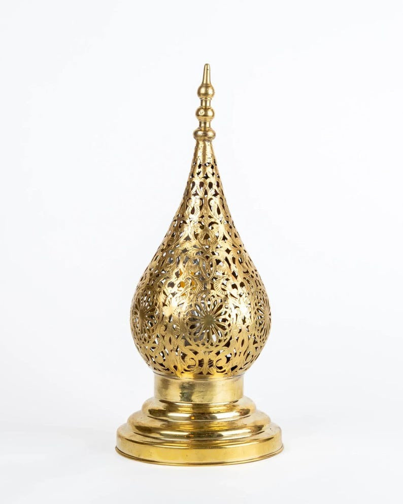 Handmade Moroccan Brass Teardrop Table Lamp – Ornate Pierced Brass Lantern with Floral Arabesque Cutouts, Warm Gold Glow and Dramatic Shadow Patterns