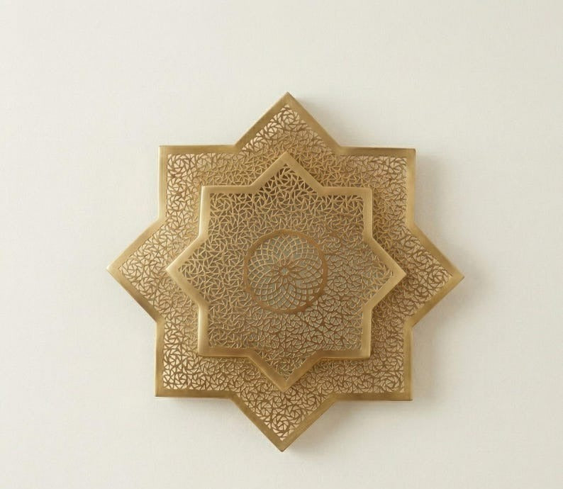 Handmade Moroccan Brass Star Wall Sconce – Pierced Eight-Point Geometric Wall Light with Warm Golden Glow and Dramatic Sunburst Shadow Patterns